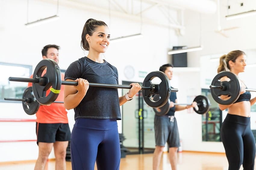 Female working out in the gym, improving her life & smile