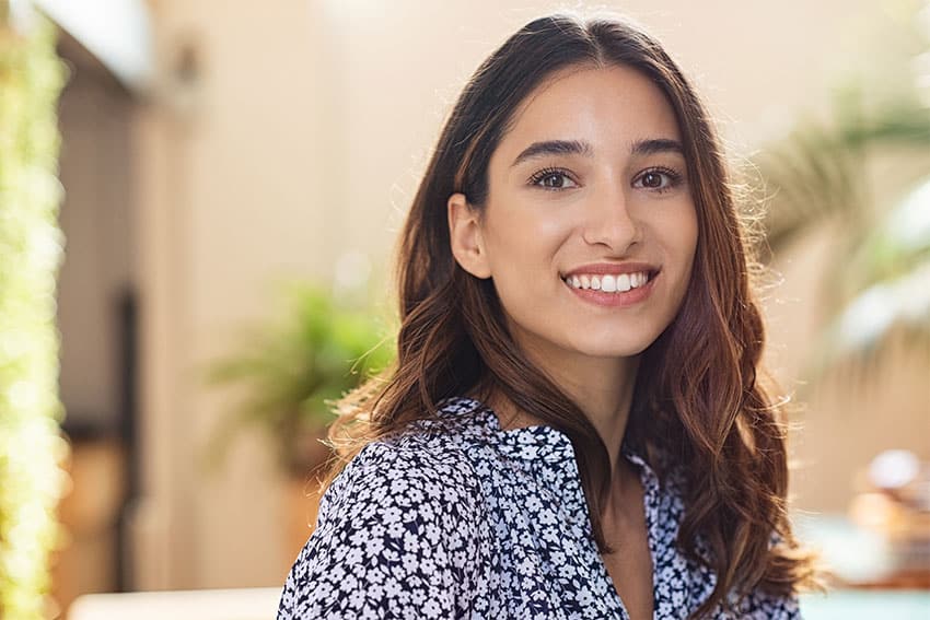 attractive young woman shows off her healthy smile